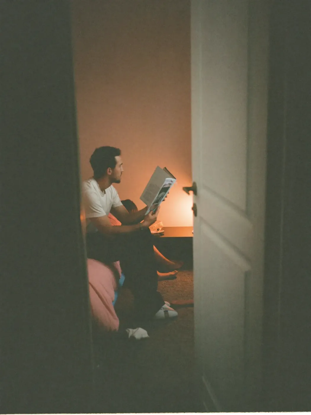 A parent reading to a child at bedtime